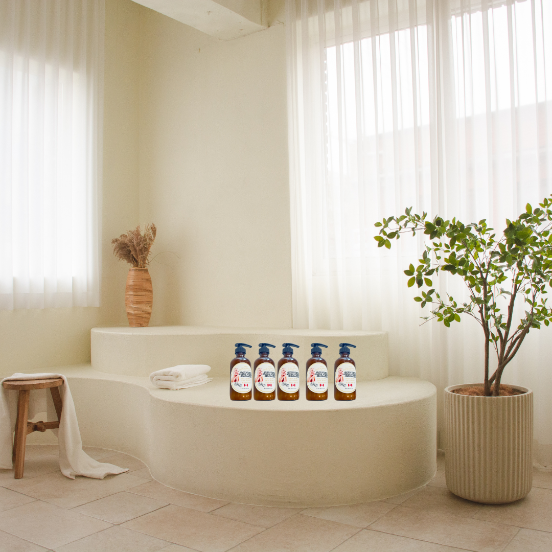 Skin Brightening and Repair lotion in 8oz amber glass bottle in the bathoom, with a plant in a big floor vase.