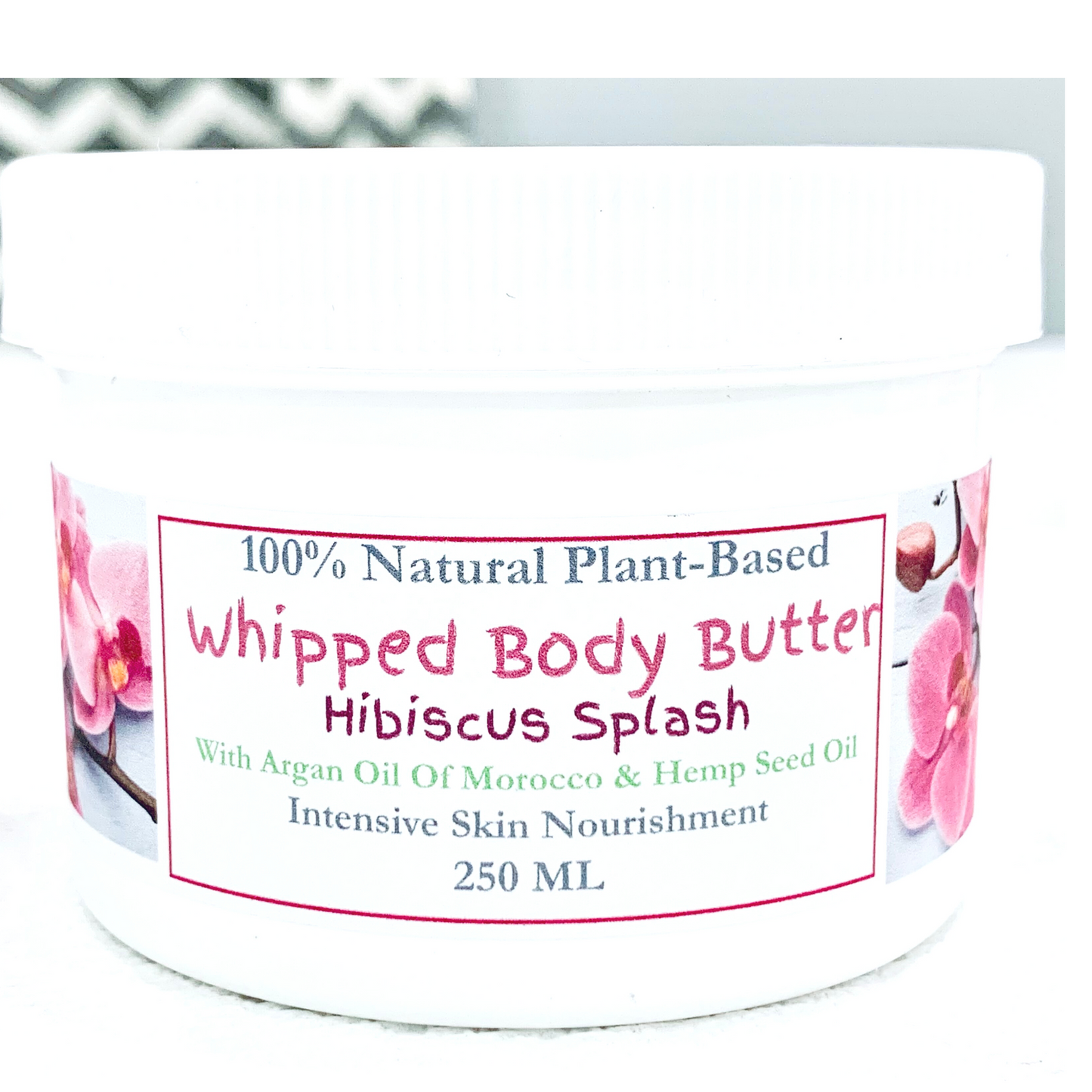 xclusiv organics handmade body butter with hibiscus flower in a white jar for dry skin