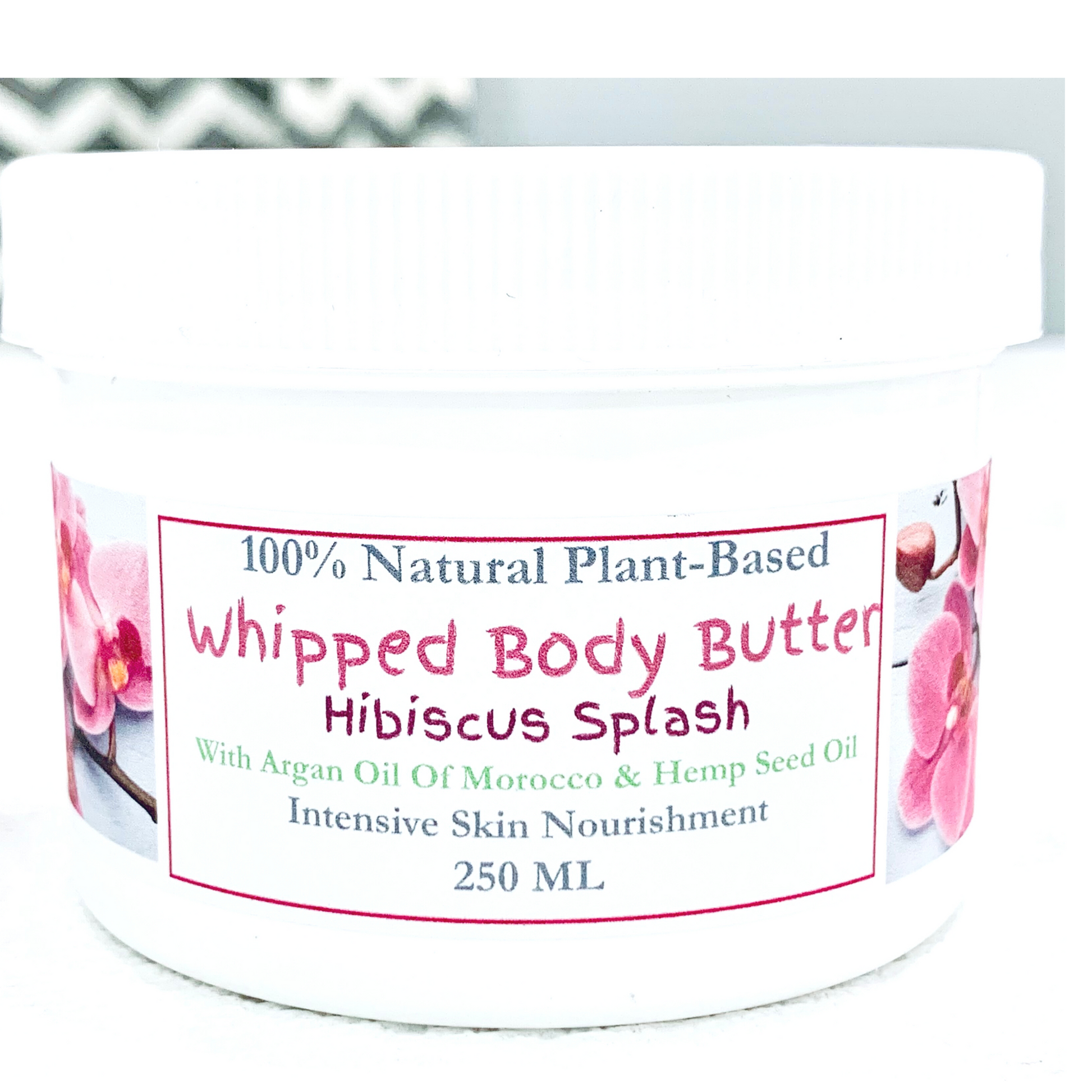 xclusiv organics handmade body butter with hibiscus flower in a white jar for dry skin